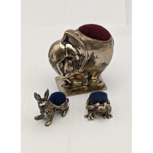 131 - Three silver pin cushions fashioned as an elephant, a frog and a rabbit, total weight 51.2g
Location... 