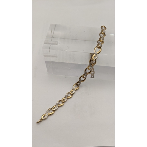 135 - A 9ct gold and diamond infinity loop bracelet total weight 4.6g
Location: CAB5