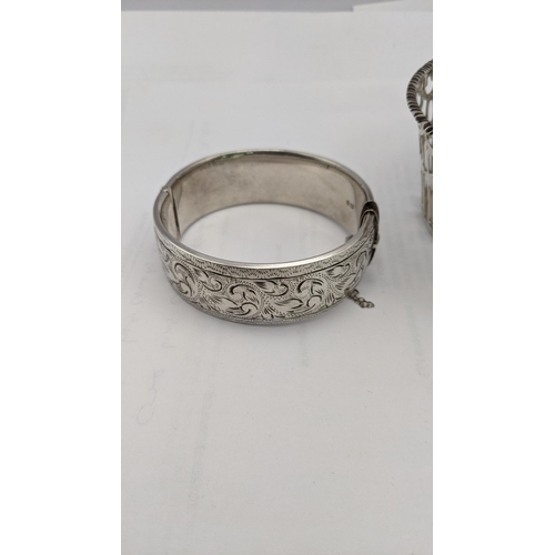 142 - Silver compromising of three napkin rings, a pierced bowl, along with a bracelet having engraved dec... 