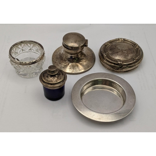 149 - Silver to include a caption inkwell, a dish, a lid, a glass salt and a blue glass and silver plated ... 