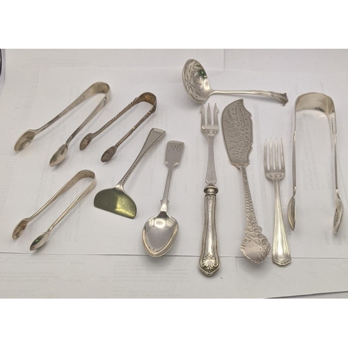 150 - Silver o include four sugar tongs, a sifter spoon, fork, spoon a pusher and a silver handled picked ... 