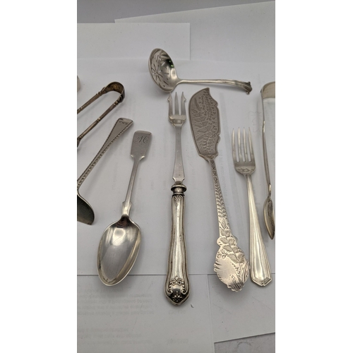 150 - Silver o include four sugar tongs, a sifter spoon, fork, spoon a pusher and a silver handled picked ... 