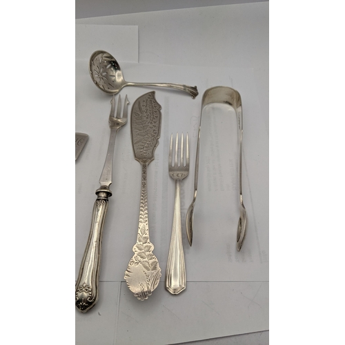 150 - Silver o include four sugar tongs, a sifter spoon, fork, spoon a pusher and a silver handled picked ... 