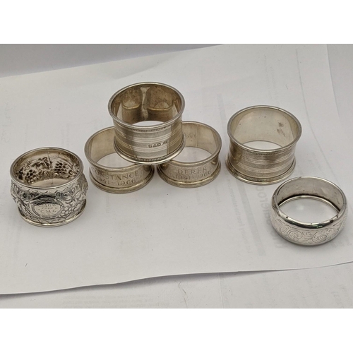 157 - Six silver napkin rings one embossed with fruiting vines, total weight 196.2
Location: