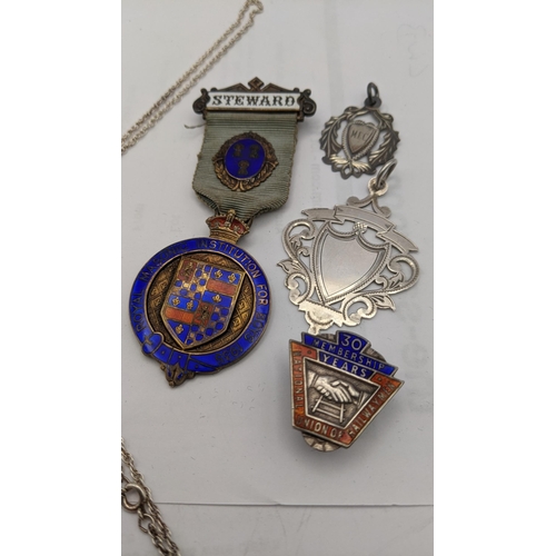 161 - Silver and enamelled badges, fobs and medals to include 30 year membership National Union of Railway... 