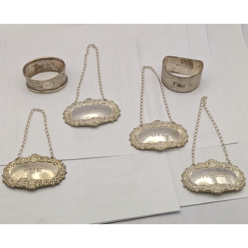 162 - Silver to include four decanter labels and two napkin rings, total weight 80.2g
Location: