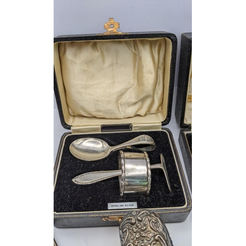 172 - Silver to include a three piece Christening set 53.3g, an egg cup and spoon 27.9g and three dressing... 