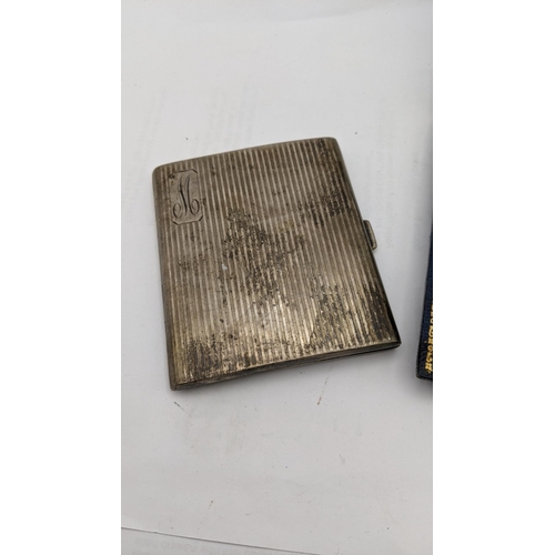 177 - A silver cigarette case together with a white metal stick pin 97.1g
Location: