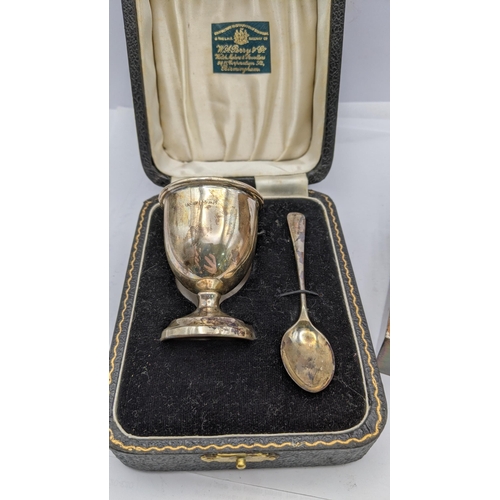 201 - A silver machine turned box along with silver egg cup and spoon in a case 
Location: