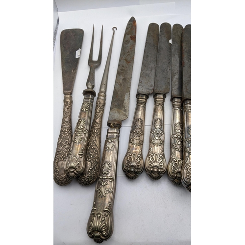 220 - A selection of embossed silver handled flatware together with a silver handled button hook and shoe ... 