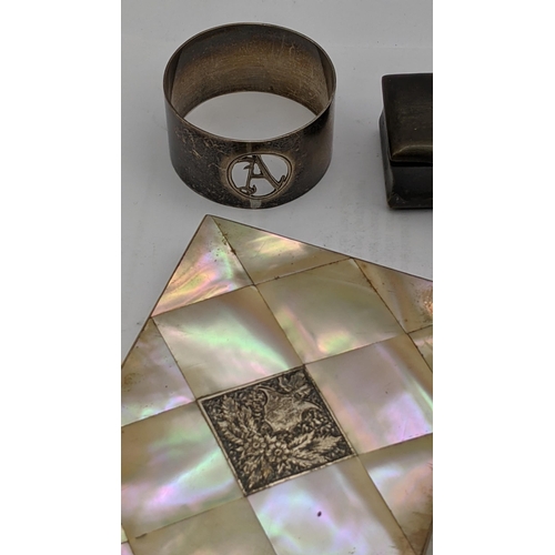 225 - A mixed lot to include two mother of pearl card cases together with a silver napkin ring, along with... 