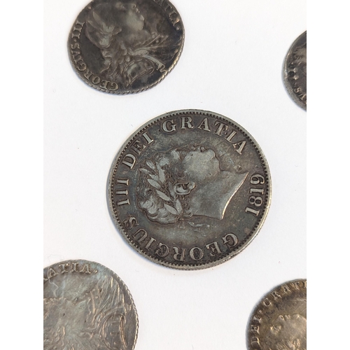 401 - United Kingdom - mixed Georgian silver coinage to include 1819 half crown, pair of 1787 shillings, 1... 