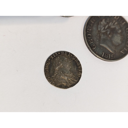 401 - United Kingdom - mixed Georgian silver coinage to include 1819 half crown, pair of 1787 shillings, 1... 