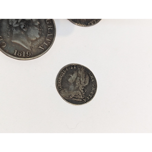 401 - United Kingdom - mixed Georgian silver coinage to include 1819 half crown, pair of 1787 shillings, 1... 