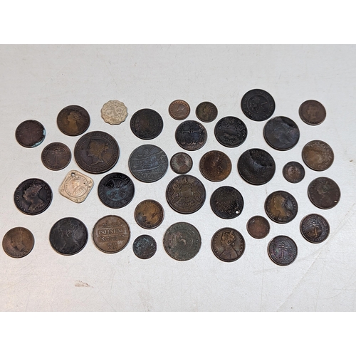 415 - British 19th century Colonial and later coins to include George III 1803 East India Company XX cash,... 