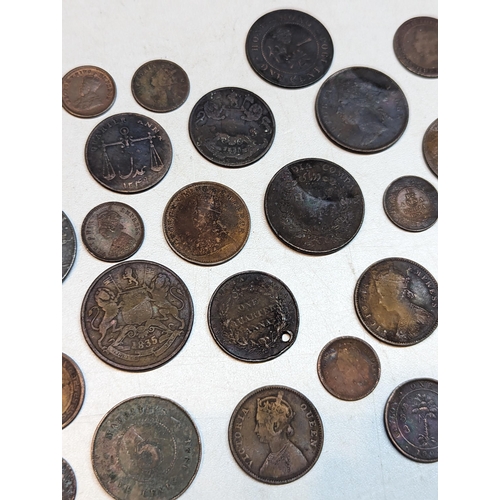 415 - British 19th century Colonial and later coins to include George III 1803 East India Company XX cash,... 