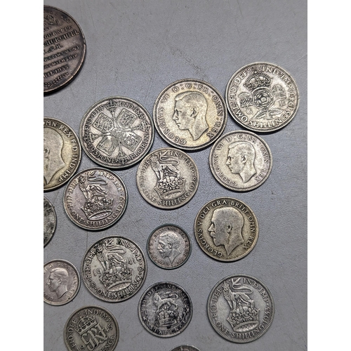 489 - British coins - a small group of pre-1947 florins, shillings, sixpence and threepence, along with a ... 