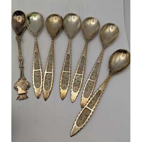 66 - Silver and white metal to include filigree teaspoons stamped 830 with four napkin rings, total weigh... 