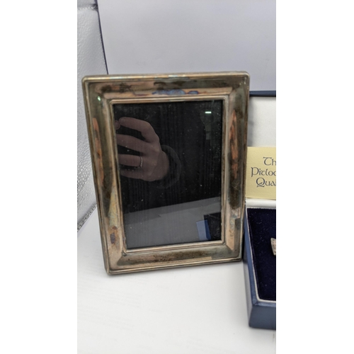 71 - A silver quaich, a modern silver photograph frame and the front of an early 20th century photograph ... 