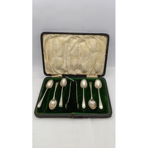 72 - A cased set of silver spoons along with a pair of sugar thongs having a floral engraved design total... 