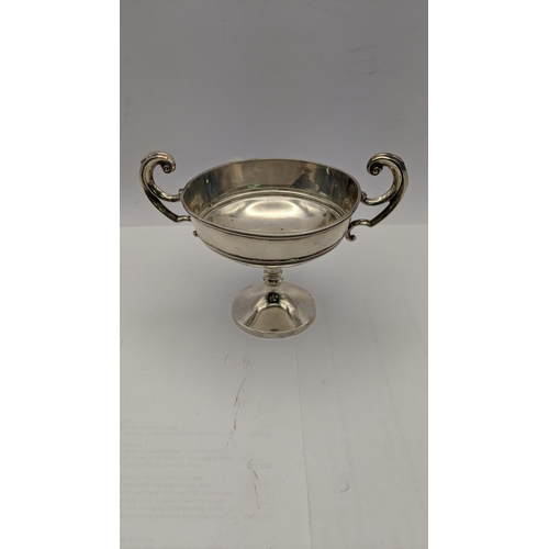 73 - A silver twin handle silver cup hallmarked London 1906, total weight 108g
Location: