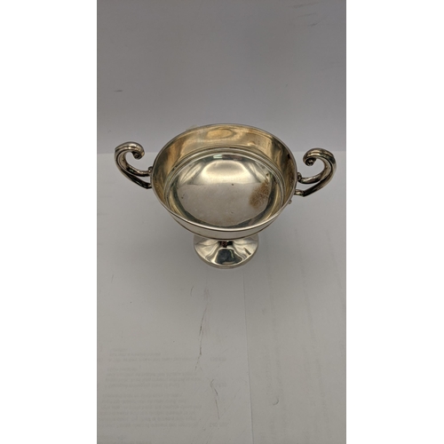 73 - A silver twin handle silver cup hallmarked London 1906, total weight 108g
Location: