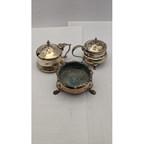 74 - Three silver condiments to include two mustard pot and a salt, total weight 149.6g
Location: