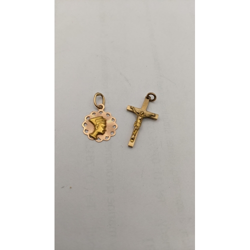 84 - A 14ct gold pendant 0.9g, together with a 9ct gold crucifix pendant 1.5g Location: CAB3