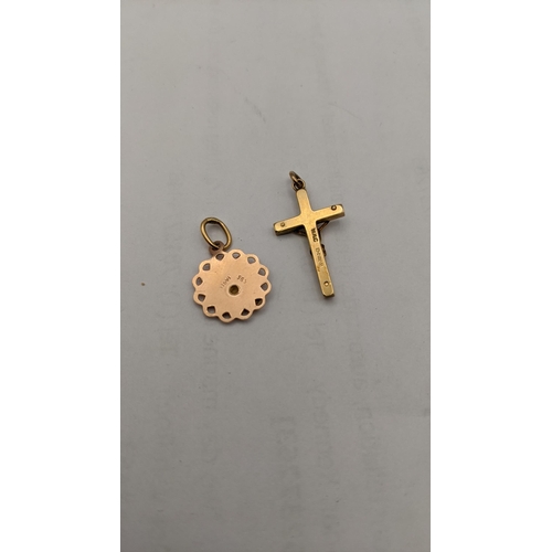 84 - A 14ct gold pendant 0.9g, together with a 9ct gold crucifix pendant 1.5g Location: CAB3