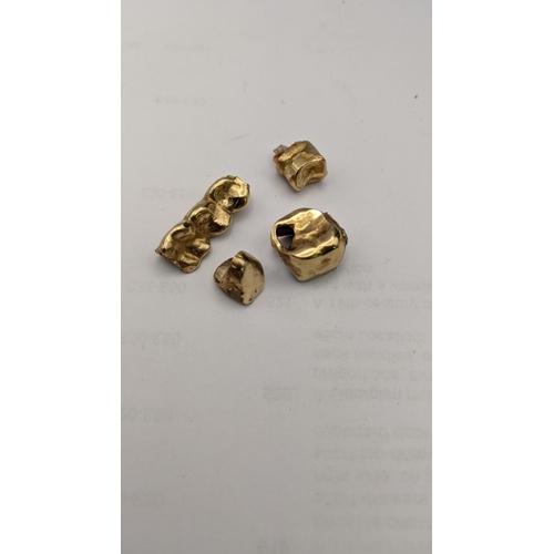 85 - A selection of yellow metal teeth, total weight 9.5g Location: CAB3