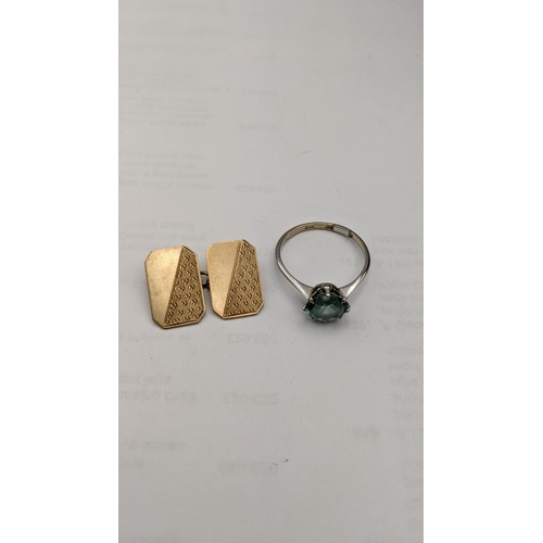 91 - A 9ct white gold ring set with a turquoise coloured stone, together with a 9ct gold cuff link, total... 