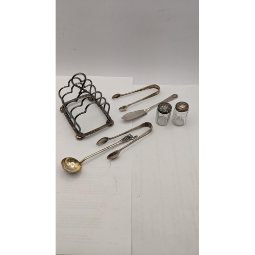 99 - Mixed silver and white metal to include a silver Birmingham 1896 toast rack together with two silver... 