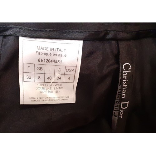 5 - Christian Dior-A pair of black woollen wide leg trousers with silk lining, UK size 8, serial number ... 