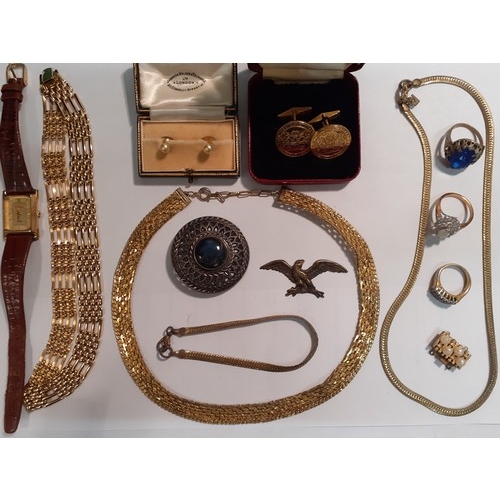 69 - A quantity of costume jewellery and a Coca Cola watch to include a pair of Churchill's club gold ton... 