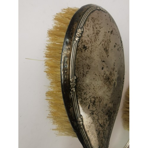 123 - Three dressing table hair brushes to include silver brushes and a white metal embossed hair brush
Lo... 