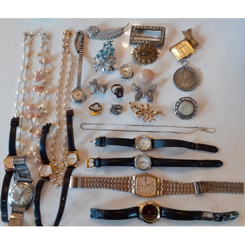 73 - A quantity of costume jewellery and wristwatches to include vintage brooches, a silver chain, a pair... 