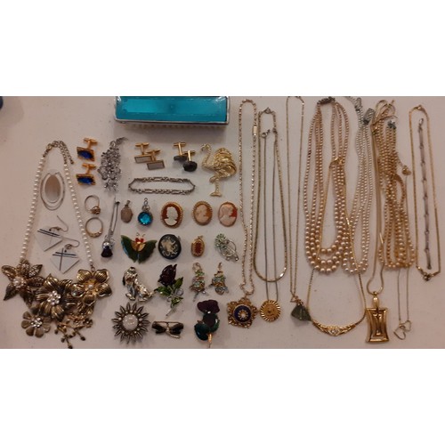 74 - A quantity of costume jewellery to include cameo brooches, cufflinks, a 1980's D'Orlan gold tone nec... 