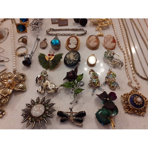 74 - A quantity of costume jewellery to include cameo brooches, cufflinks, a 1980's D'Orlan gold tone nec... 