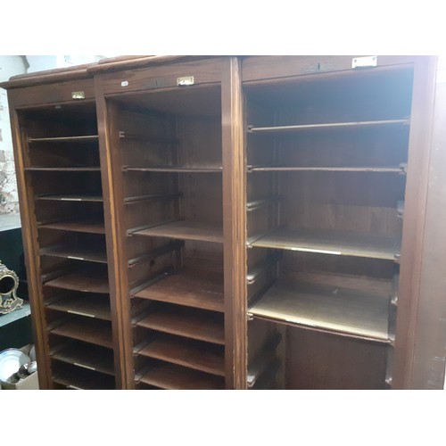 28 - A large breakfront 3 tambour door stationary cabinet with internal shelves, 148cm wide x 46cm deep x... 