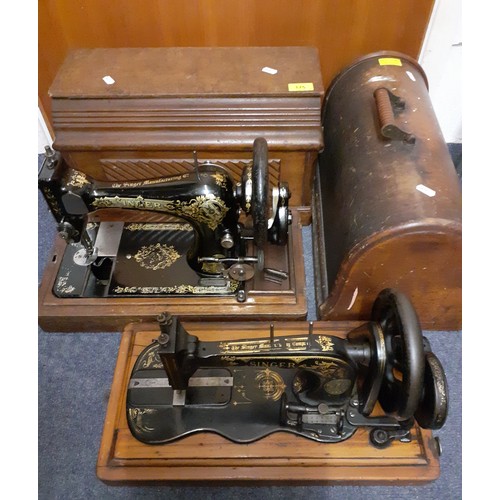 175 - Two vintage Singer sewing machines comprising a 1908 model in an oak case serial no:V125208 and a 19... 