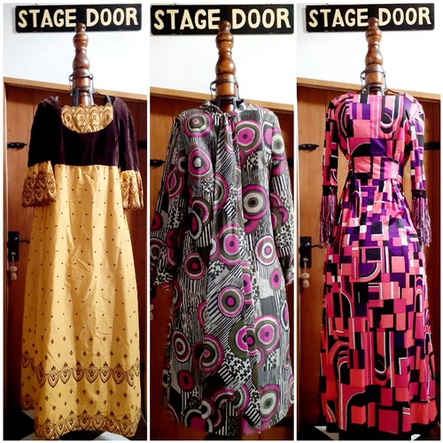 Three 1970's dresses comprising a Quad mustard yellow silk effect and brown velvet evening dress having short scalloped sleeves and a pierced design in the Georgian style, 36" chest x 51" long, a Kitty Copeland Terlenka calf length dress in a purple, black, green and white psychedelic pattern and matching sash to the neckline, UK size 16 and a DL Barron of London geometric design full length dress in pinks, purple, black and white having tasselled cuffs, UK size 12. Location:RWB
Condition: One small hole to the chest area of the Barron dress-see additional photos.