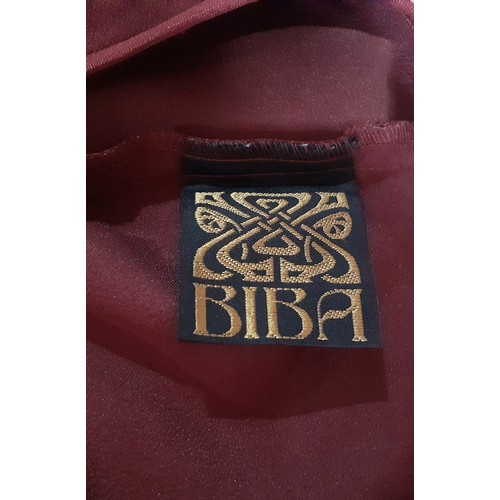 12 - Biba- A 1990's deep red satin slip dress with spaghetti straps, 36