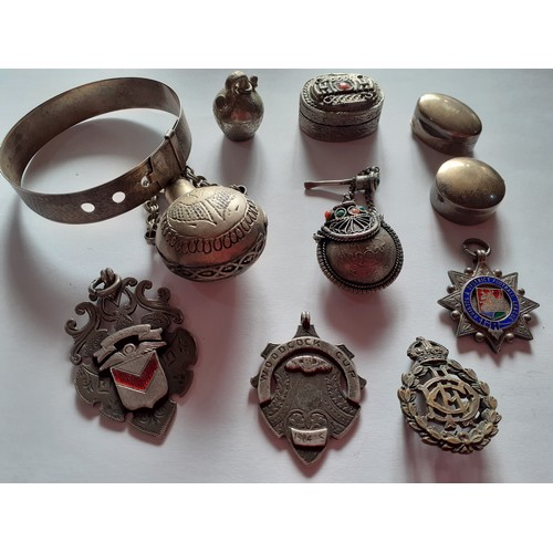 94 - A quantity of silver and white metal items to include miniature silver boxes, a silver bangle in the... 