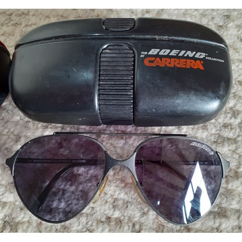 93 - Two pairs of vintage sunglasses comprising a pair of 1980's Boeing Carrera matt black framed sunglas... 