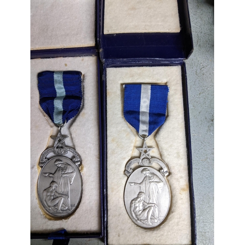 187 - **THIS LOT HAS BEEN WITHDRAWN**
A leather case containing Masonic aprons, and various medals to incl... 