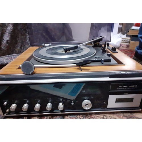 188 - A vintage National Panasonic compact stereo system with teak housed speakers and manual. 
Location:G