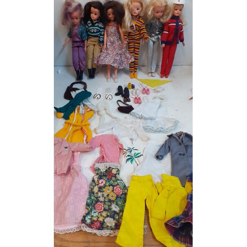 139 - Six 1980's Sindy dolls stamped 033055X to the rear of the neck wearing clothing and footwear togethe... 