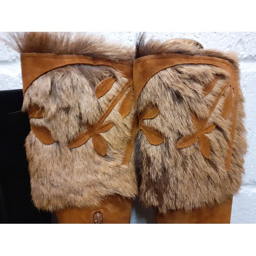 44 - Charles Jourdan- A pair of 20th Century brown suede and animal fur boots with 3½