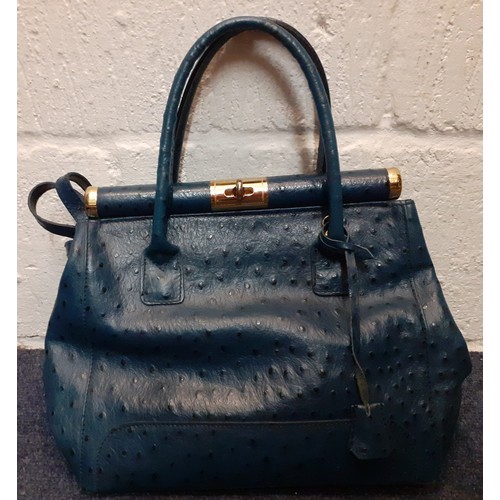 100 - A quantity of vintage bags to include a Pelle di Giada blue ostrich handbag having gold tone hardwar... 