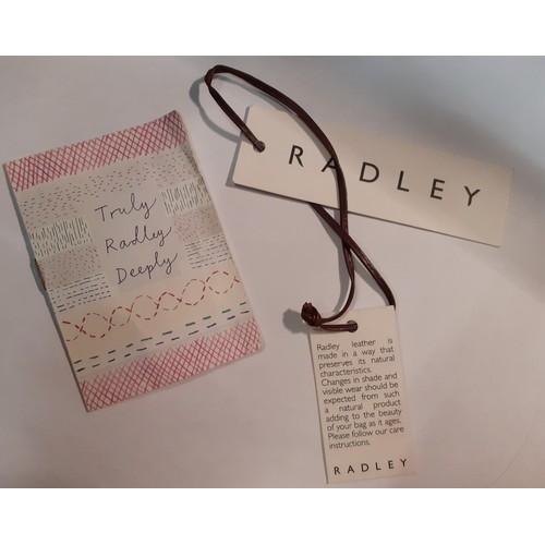 101 - Radley and DKNY-Two handbags comprising a brown leather Radley basketwork effect handbag with origin... 